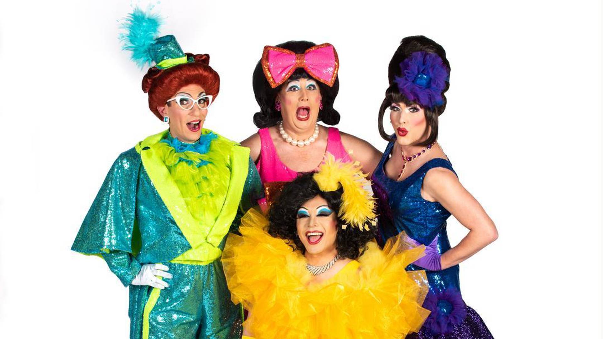 The Kinsey Sicks - four drag performers posing together in bright, colorful sequined formal outfits with ruffles, feathers and bows.