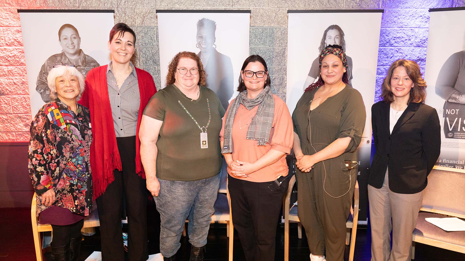 A group of 6 women stand together for a photo.