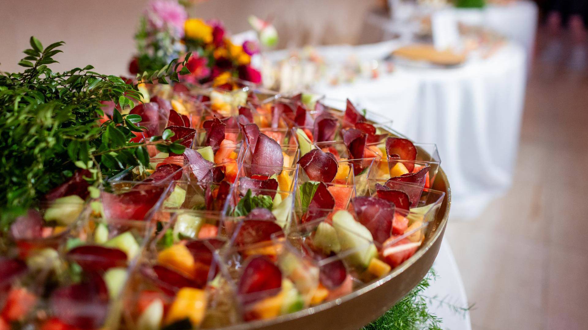Colorful fruit samplers in clear containers.