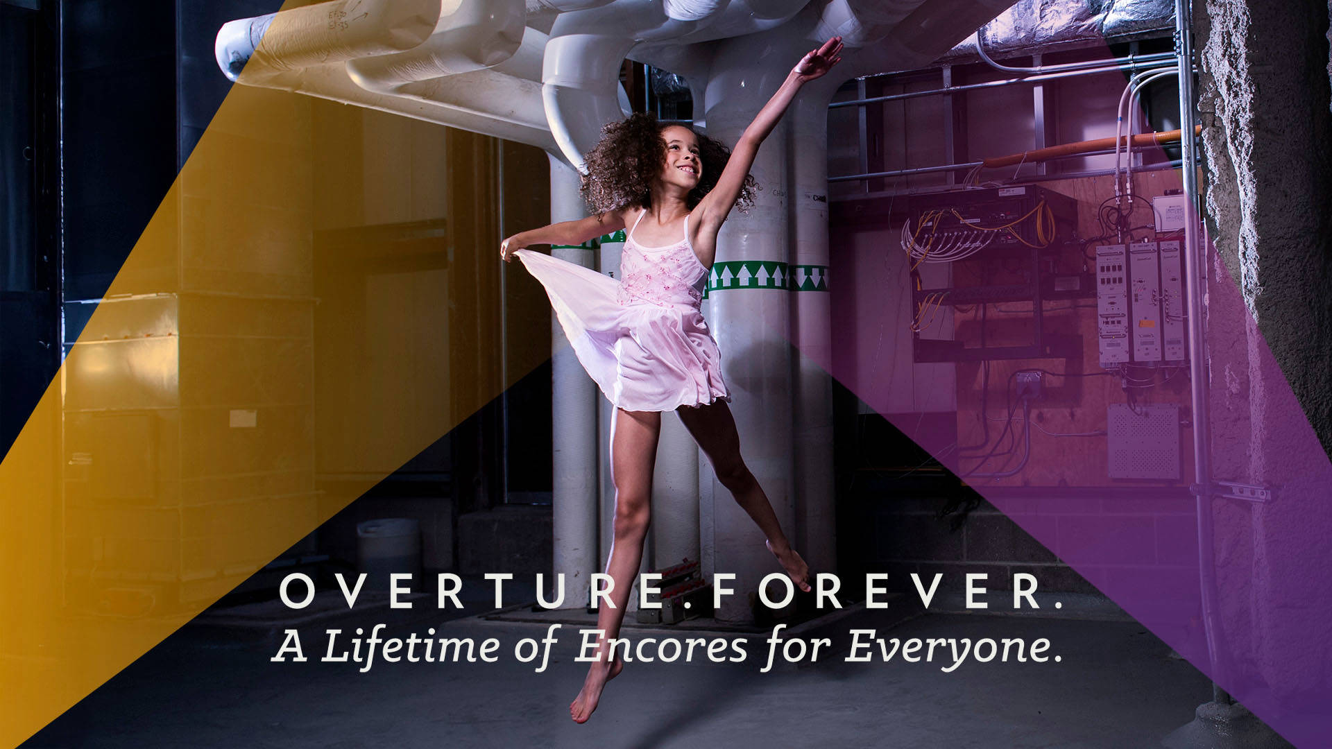Banner text reads, "Overture. Forever. A Lifetime of Encores for Everyone." A young girl with medium complexion and curly brown hair wears a pink dance dress and leaps in the air with a big smile. She is in an industrial setting with large pipes behind her. There are opaque yellow and purple streaks in the design.
