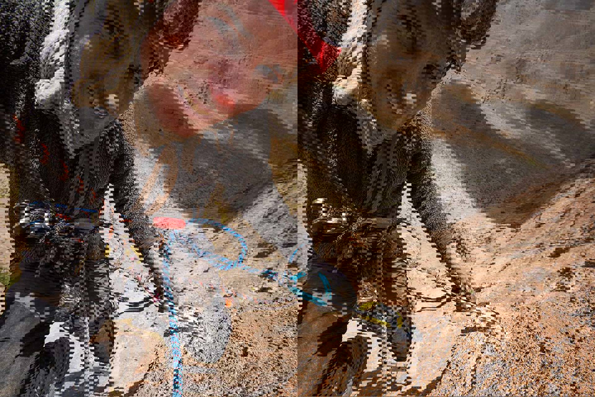 Robbie Shone up close shot. he is rock climbing in a desert landscape