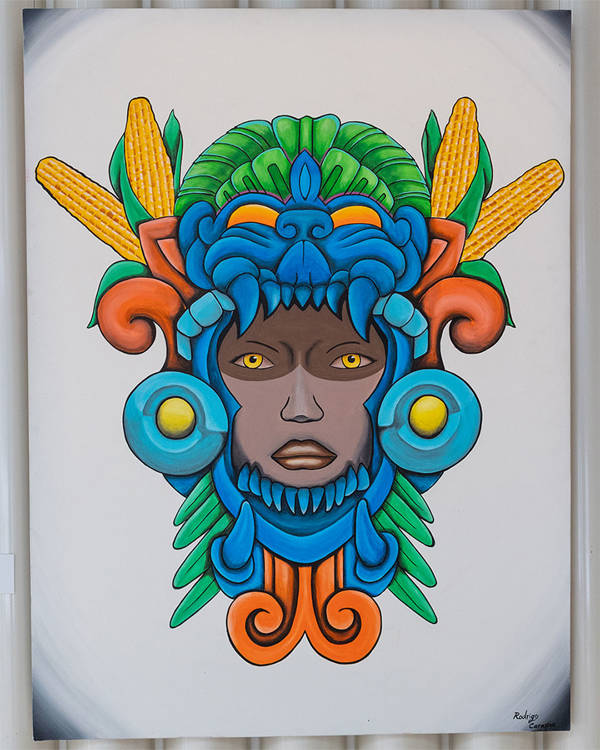 A colorful portrait portraying a woman face surrounded by a vibrant statue-like structure.