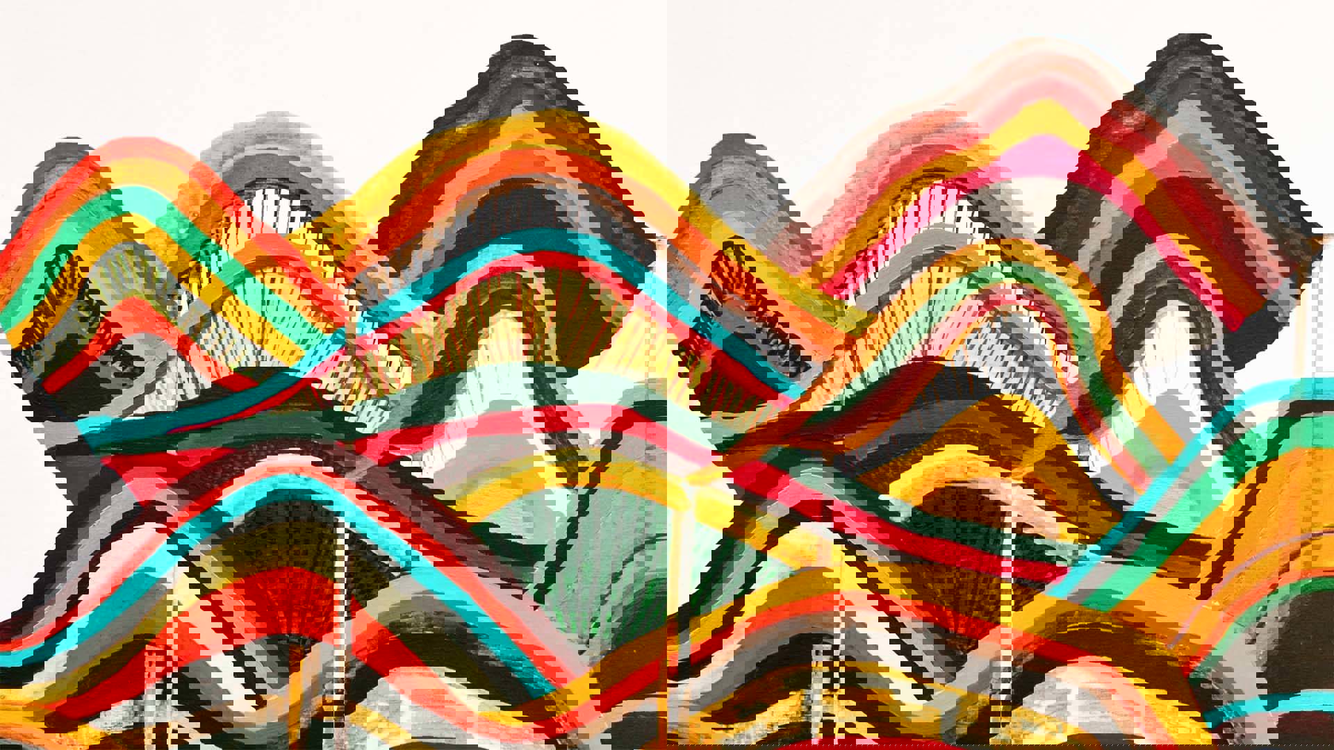 Abstract painting with yellow, red and forest green squiggly hills.