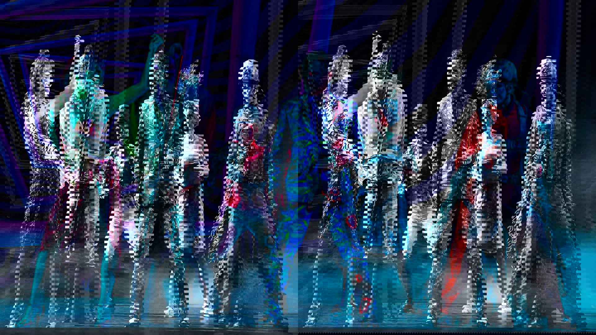 The cast of Beetlejuice performing on stage.