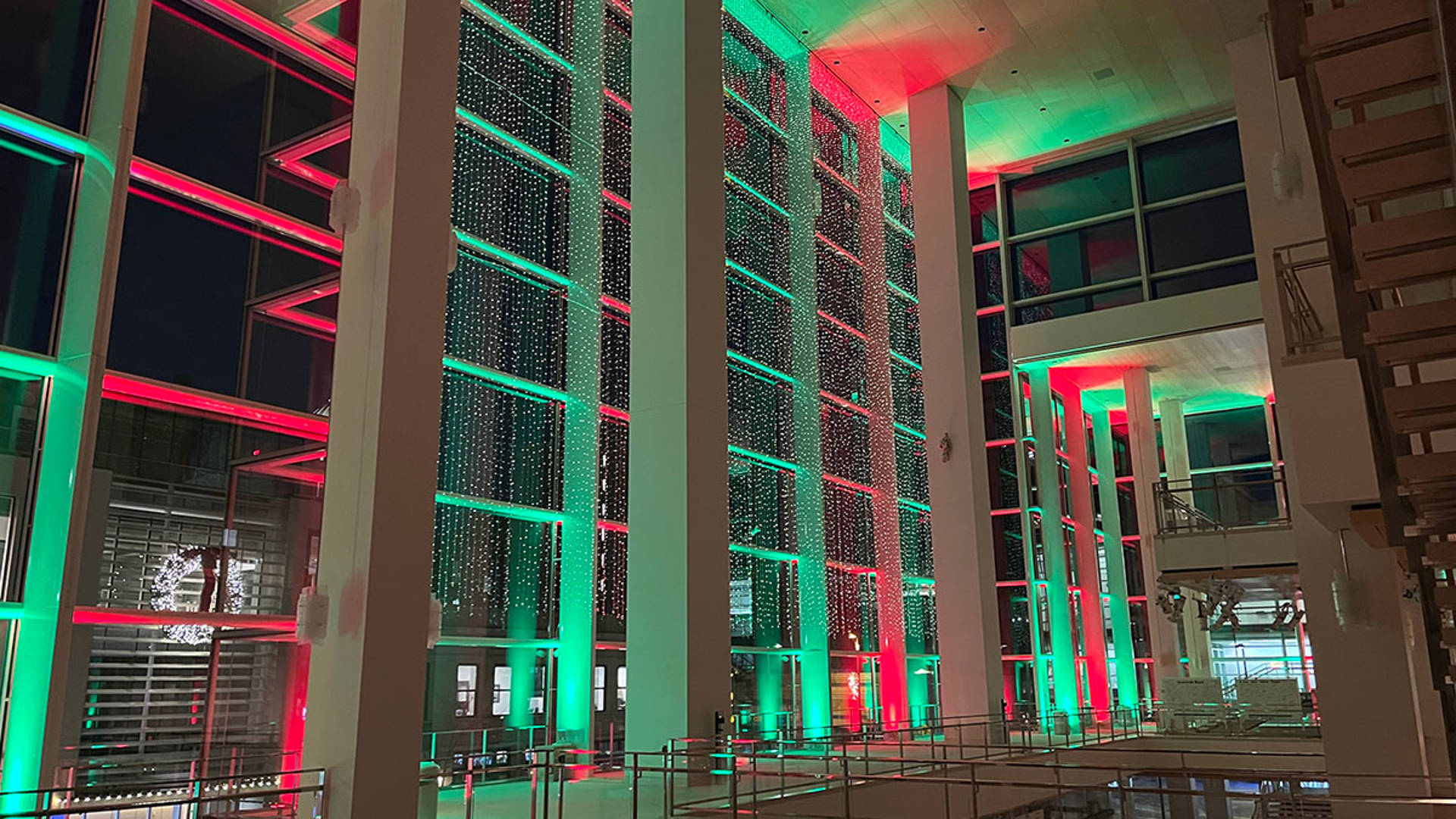 Red and Green lights fill Overture Hall Lobby