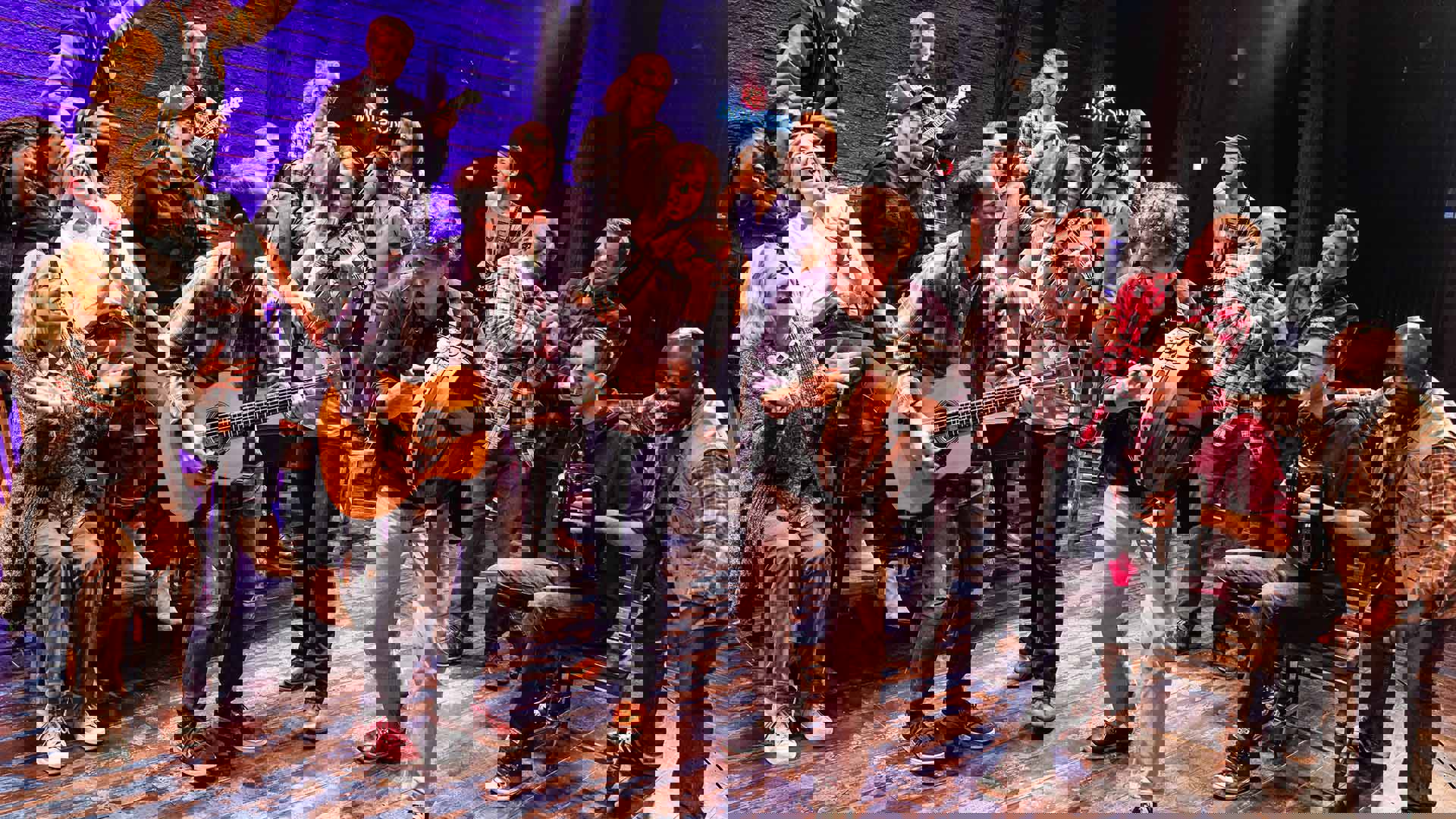 The cast of Come from Away performing on stage