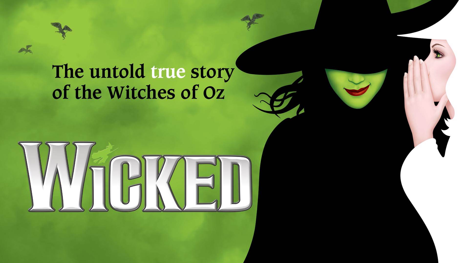 The key art for Wicked. A witch in a white robe whispering into the ear of a witch with green skin in black. The background is a cloudy green color. The text reads "Wicked: The untold true story of the witches of Oz."