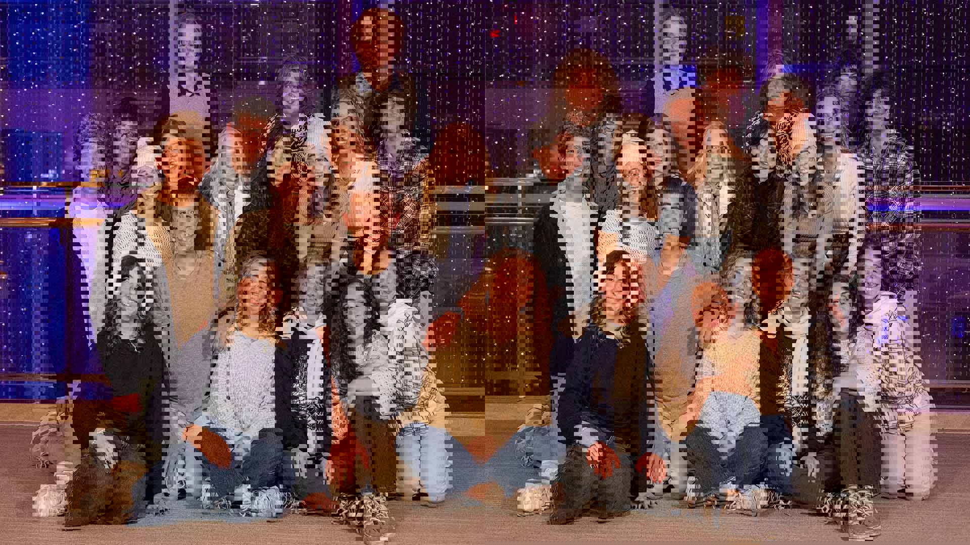 A group of high school students posing for a picture in winter blue outfits.