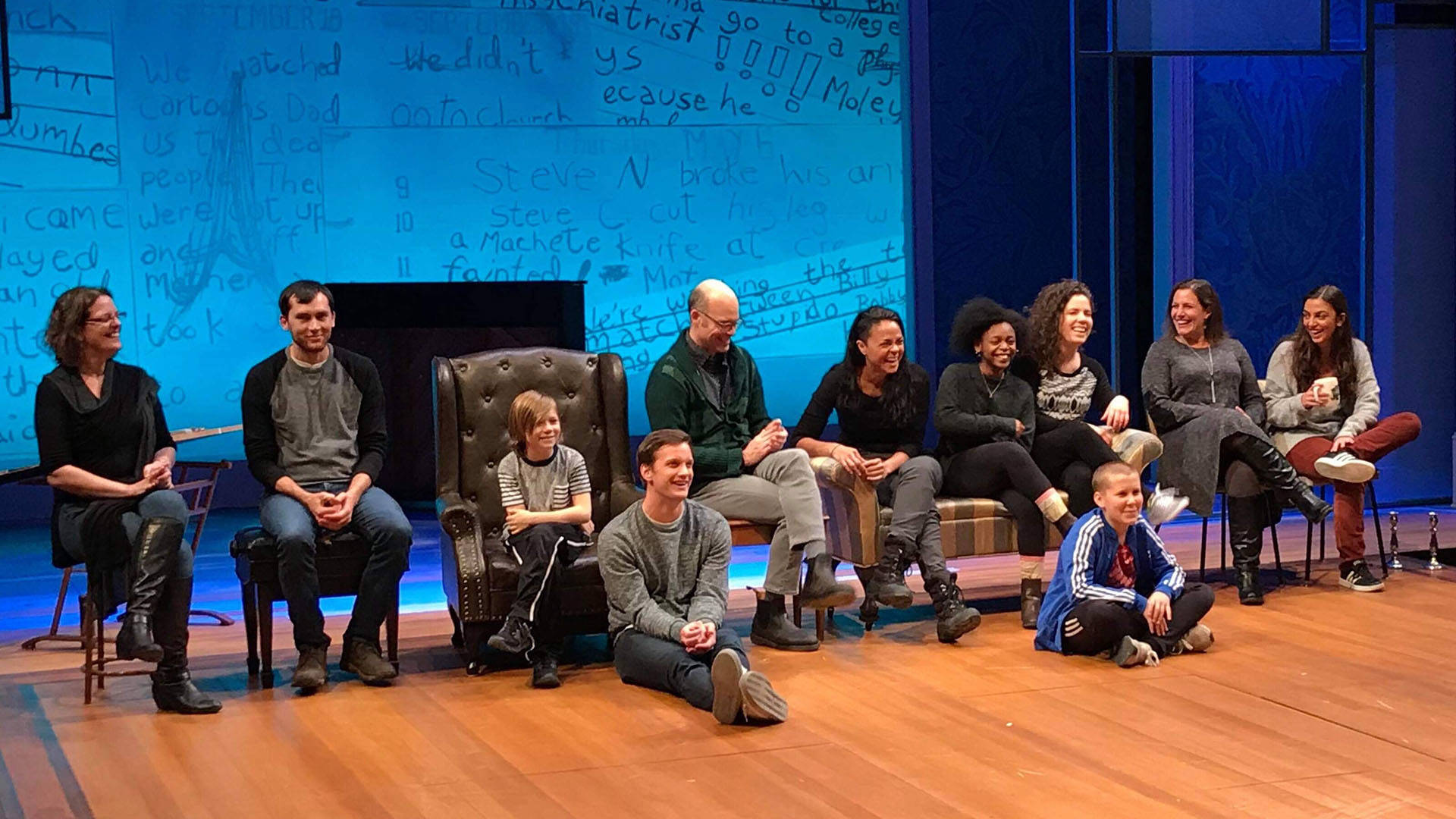 A cast doing a talkback on a stage