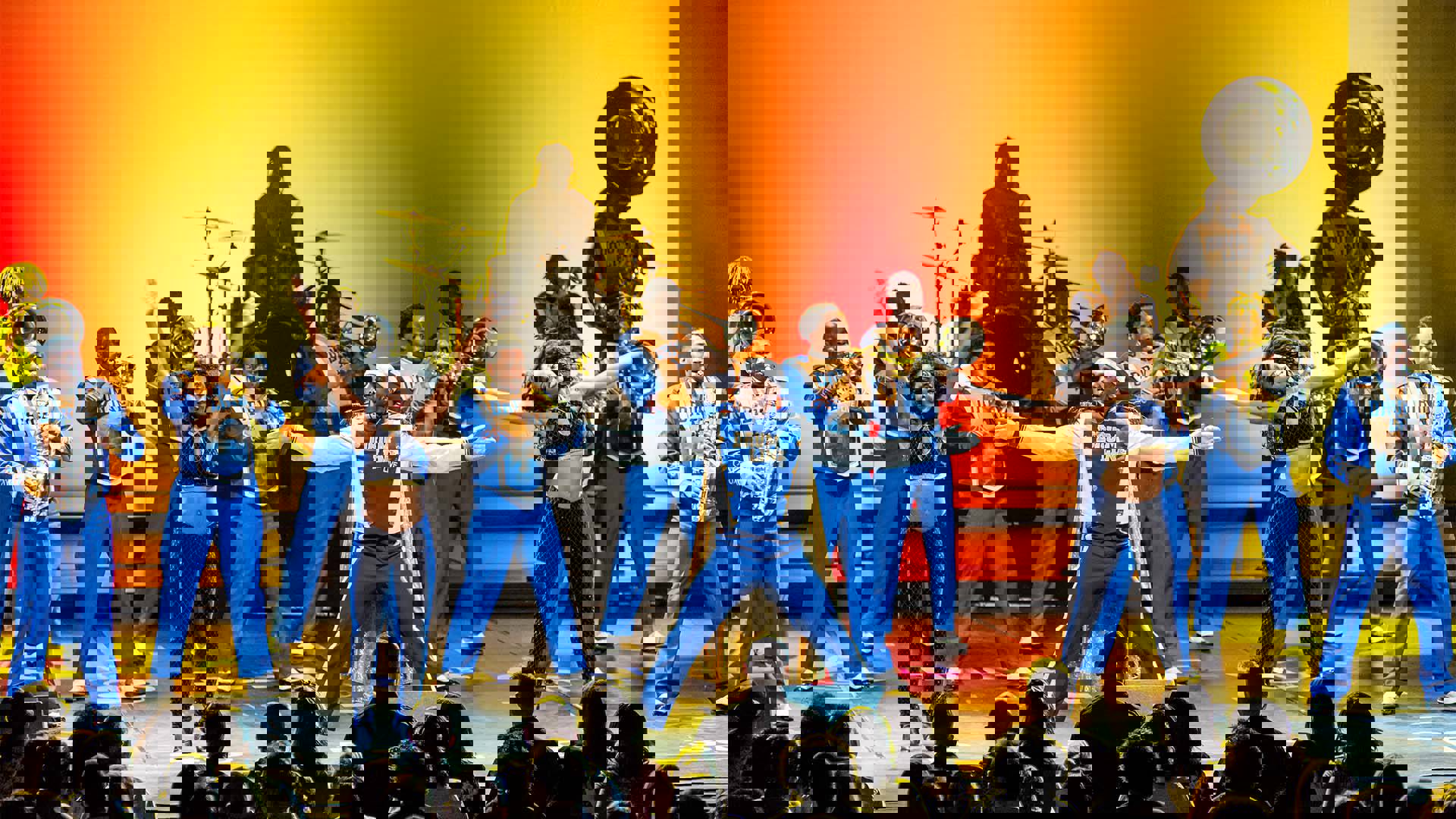 Drumline Live's African-American marching band performing on stage.