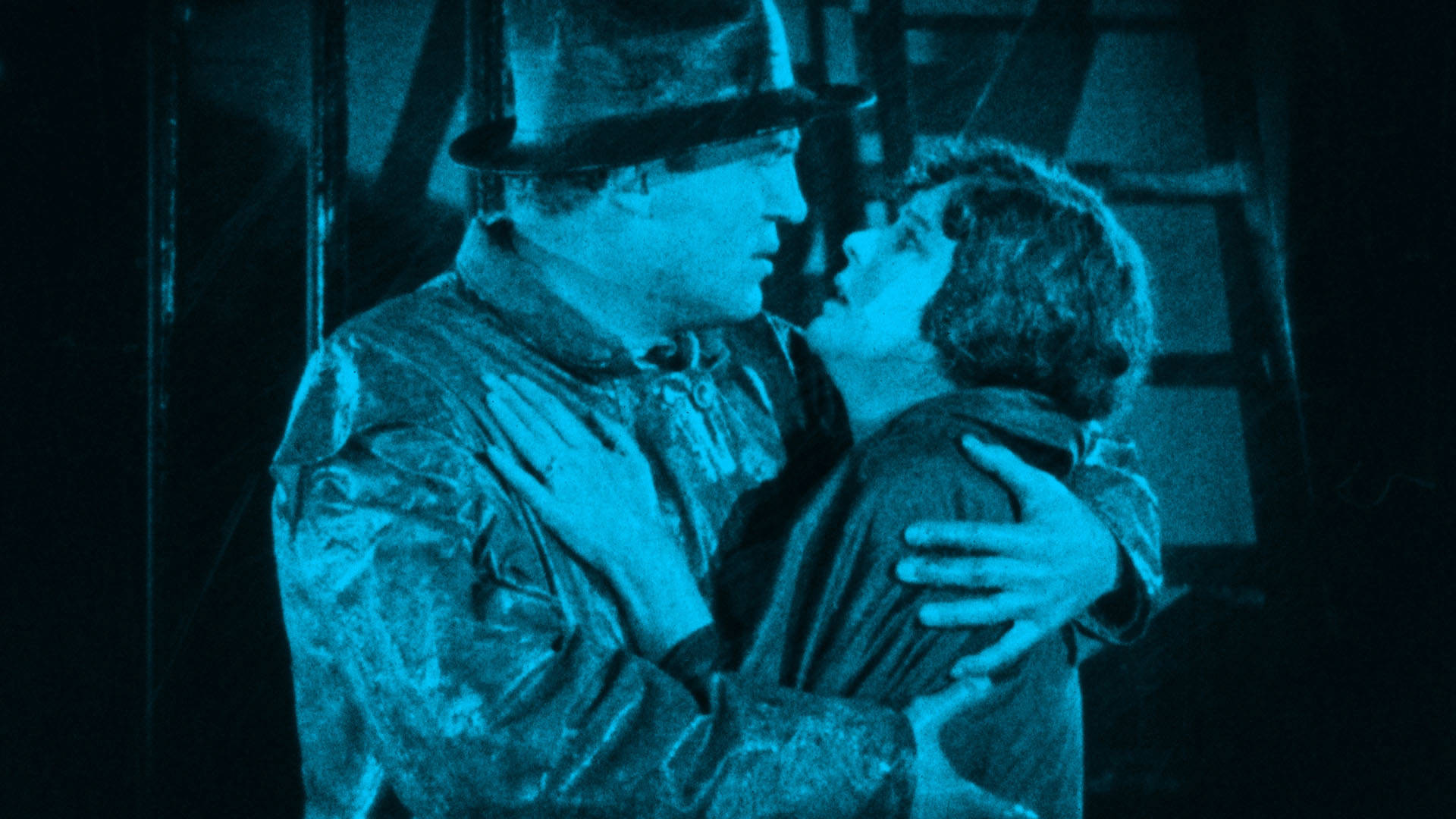 Dave Taylor (played by Rockliffe Fellowes) and Sally Taylor (played by Virginia Valli) embrace each other in a scene from "The Signal Tower (1924)."
