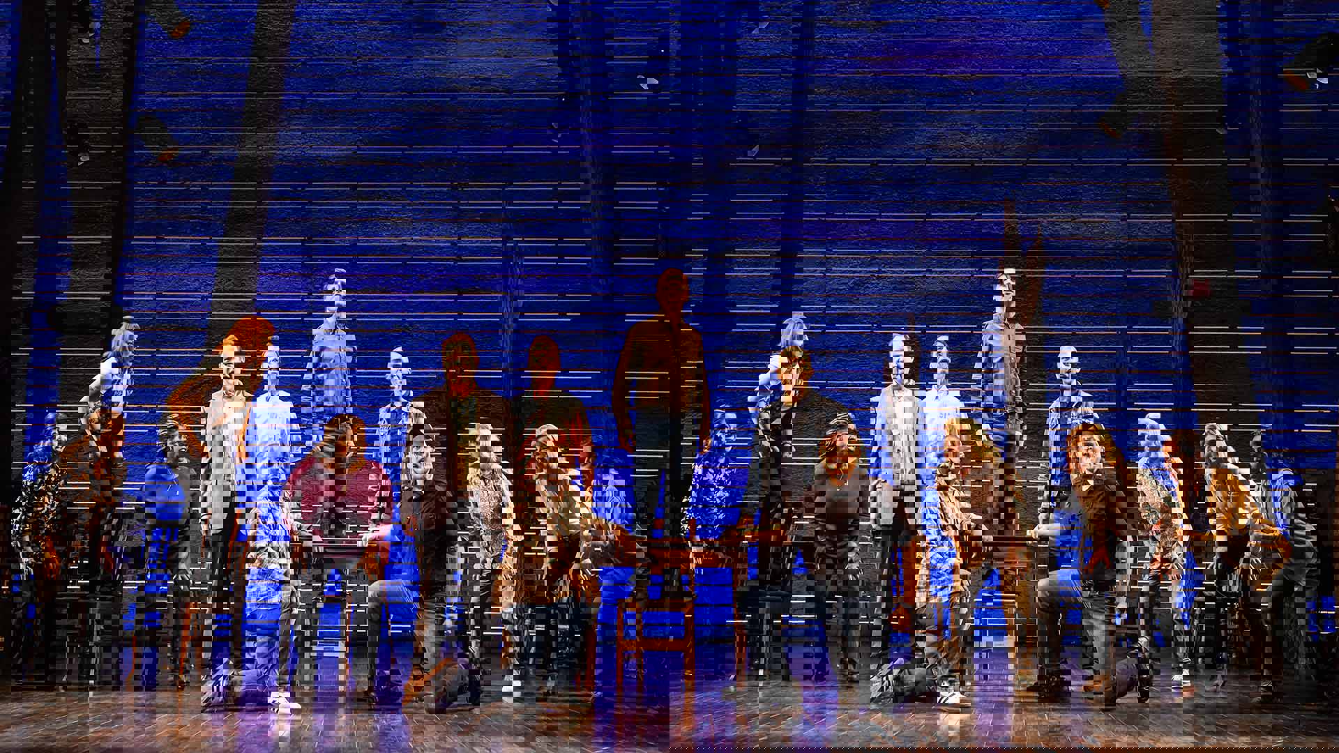 The cast of Come from Away performing on stage