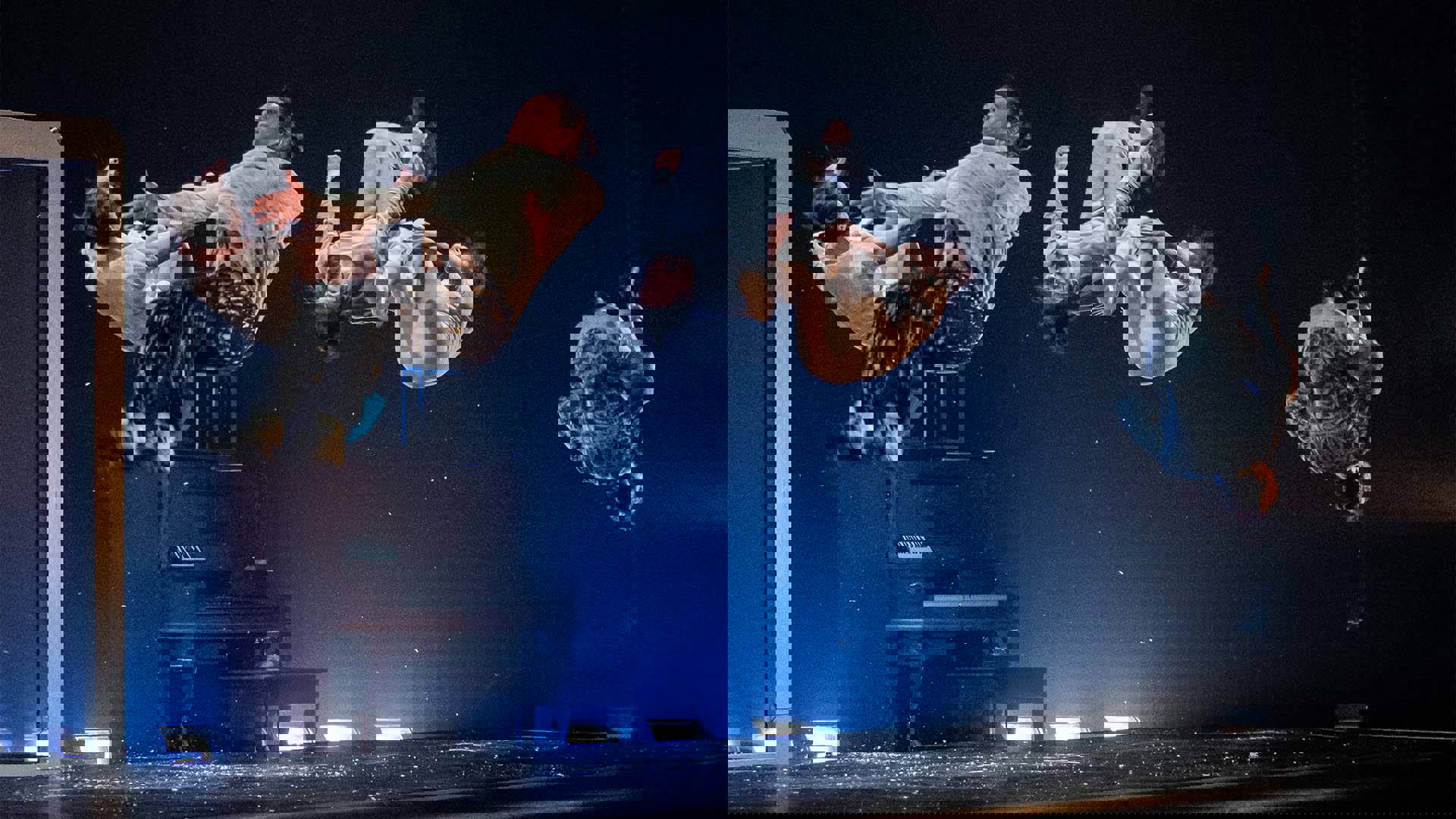 Five dancers in the midst of backflips on stage.