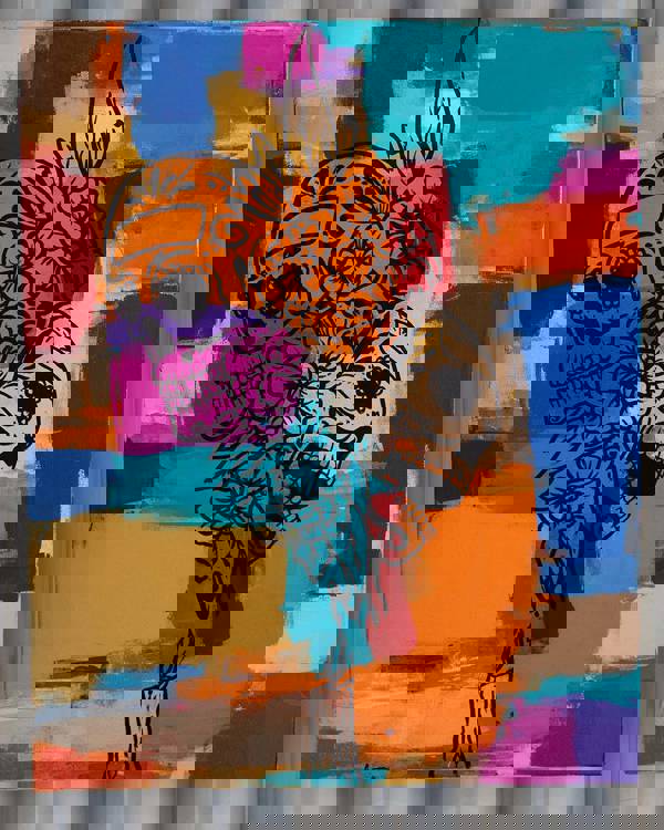 A colorful painting portraying skulls and flowers.