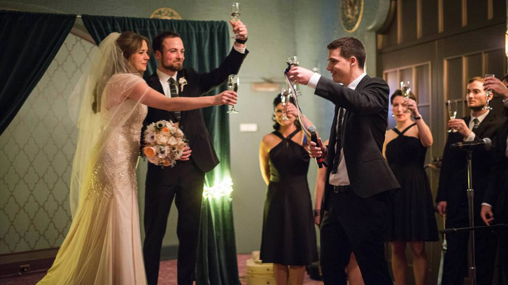 A bride and groom toasting to their wedding.