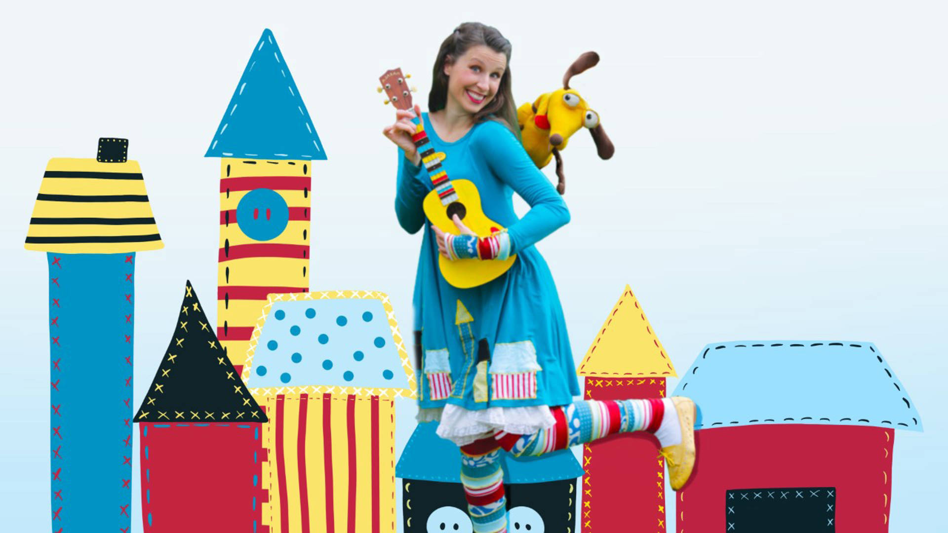 Jolie stands in a bright blue dress holding a yellow ukulele smiling. She has long brown hair. There is a yellow puppet on her shoulder. The background is of cartoon buildings in red, blue and yellow.