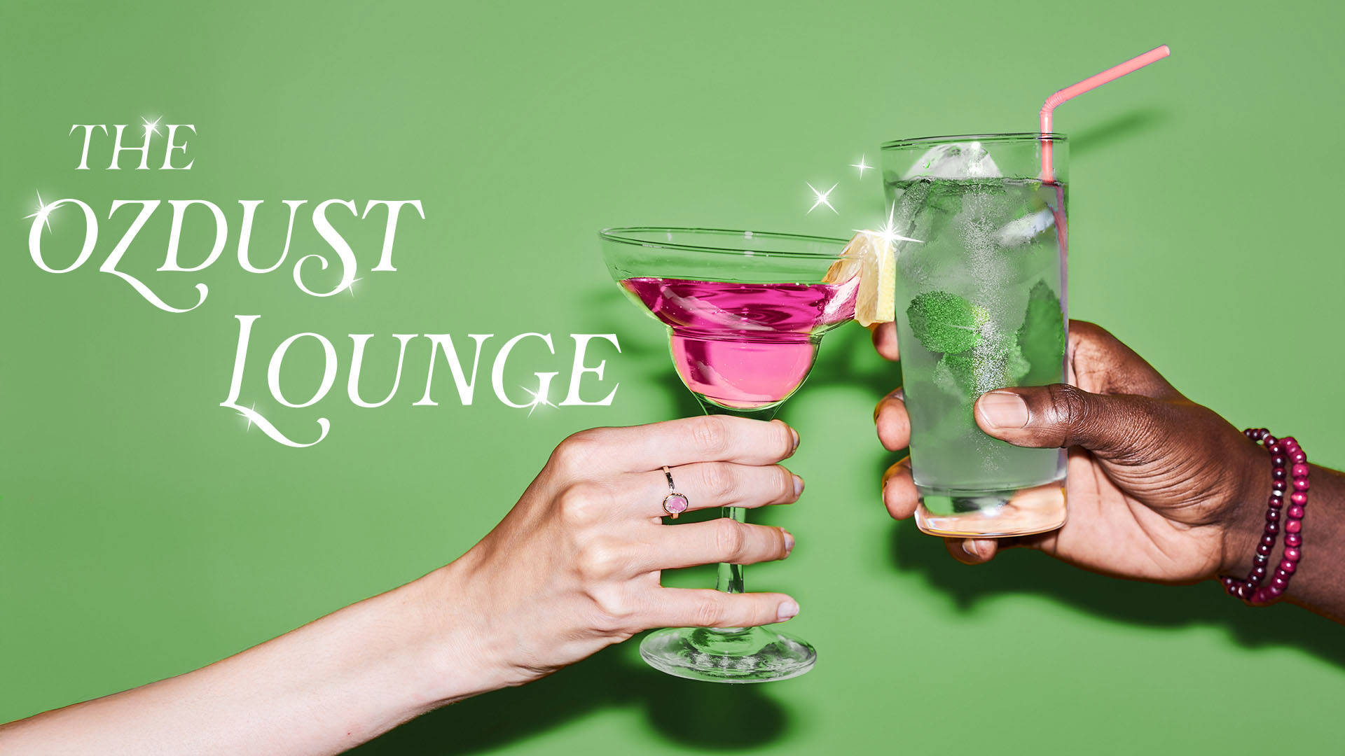 Green banner that reads: "The Ozdust Lounge" in white sparkling font. Two hands, one with light complexion, the other dark, toasting two cocktail drinks, one pink in a martini glass, the other a tall glass with mint and ice.