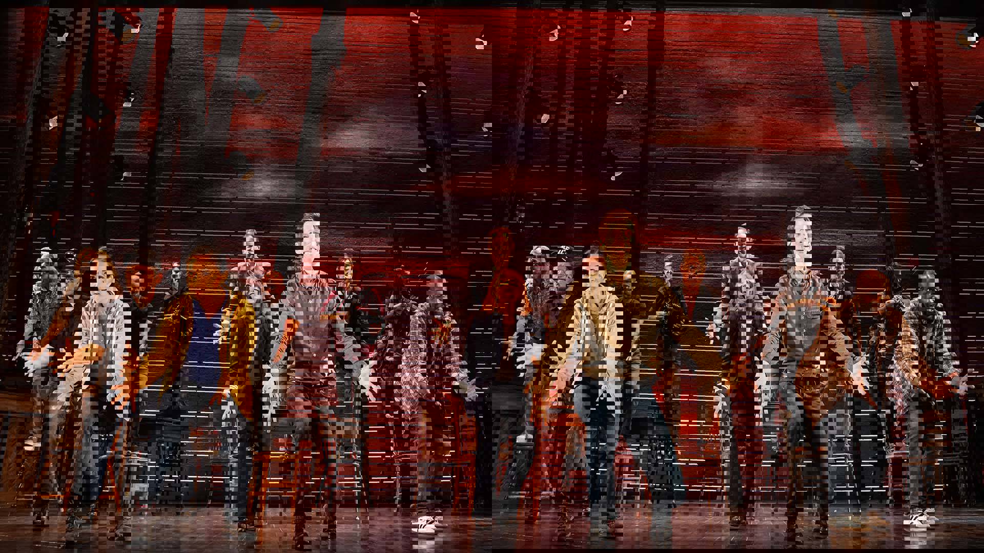The cast of Come from Away performing on stage