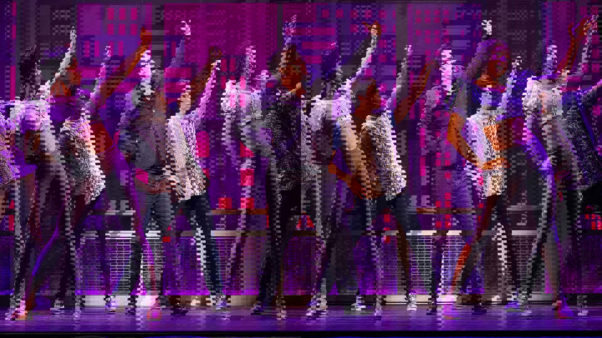 The cast of Tootsie dancing in unison on stage.
