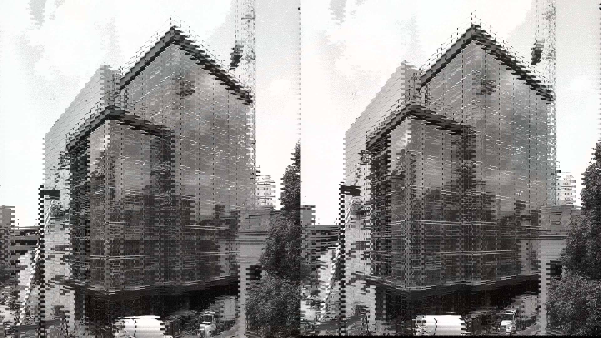 Overture during construction with glass panels on Fairchild St being installed. Black and white image.