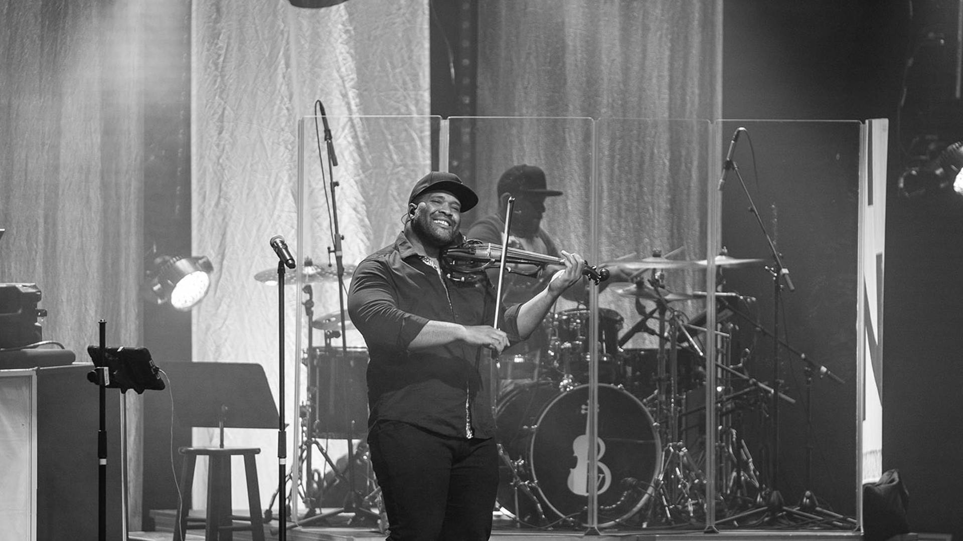 Kev Marcus and drummer performing on stage.