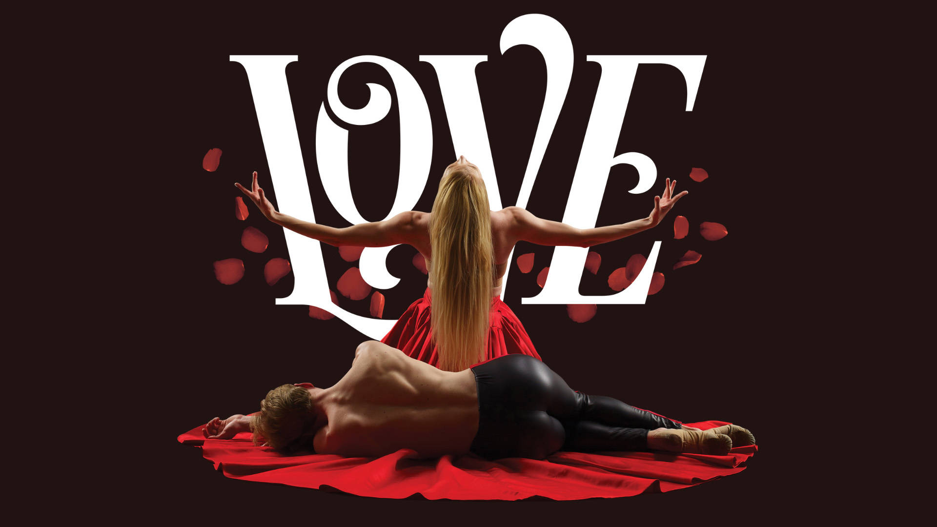 Banner text reads "Love". Two performers facing away. One wearing only tight black pants is laying on their side. The other has long blond hair and is wearing a red outfit with their arms outstretched.