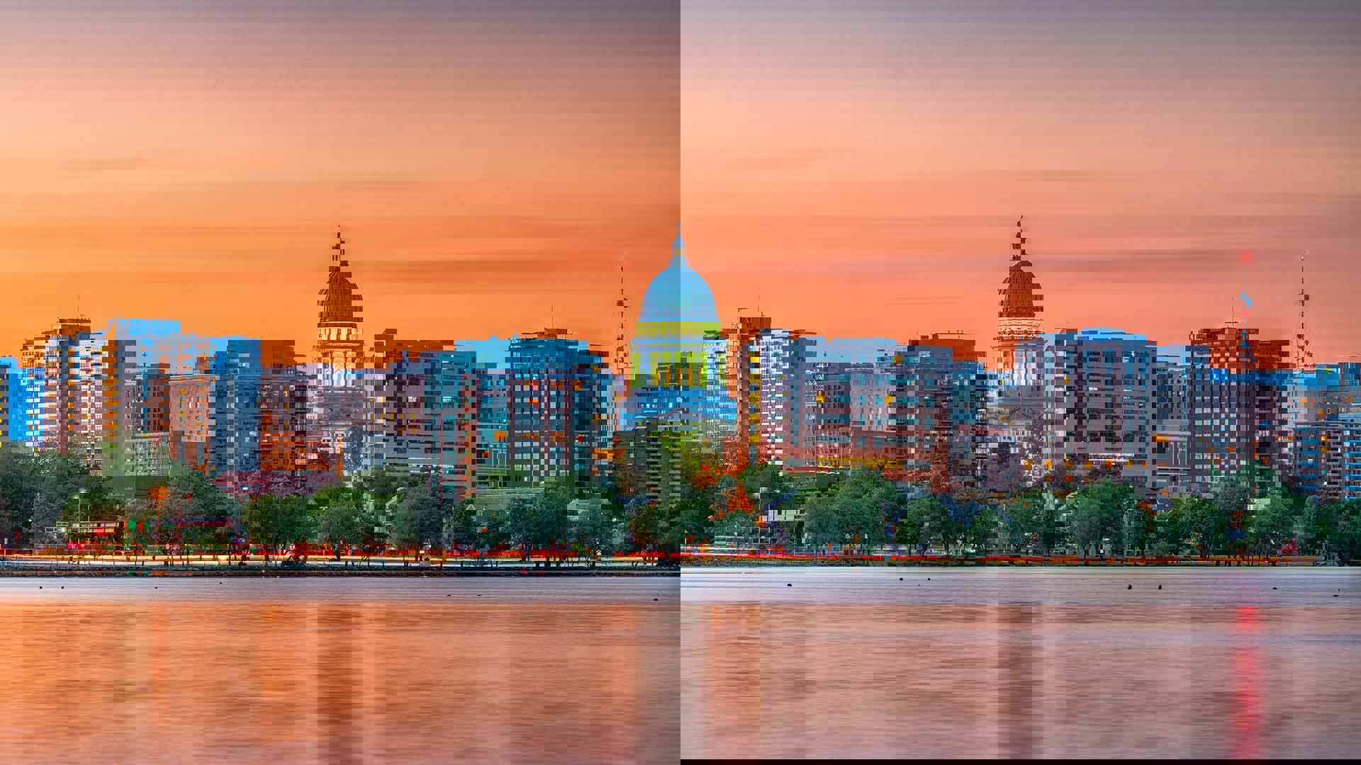Evening view of the Madison skyline from Lake Monona. The state capitol building is at the center.