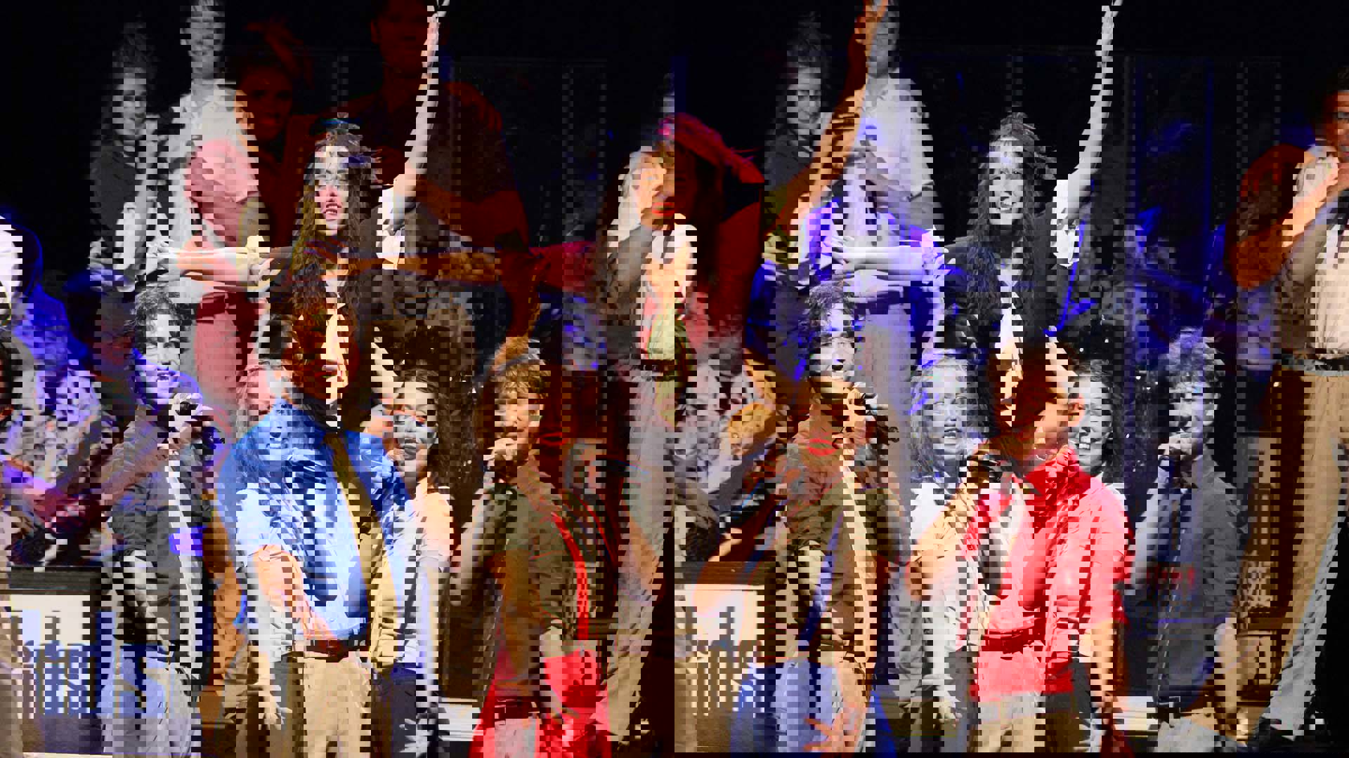 Kids from Wisconsin performing on stage. Five main performers are holding microphones and holding out their hands.