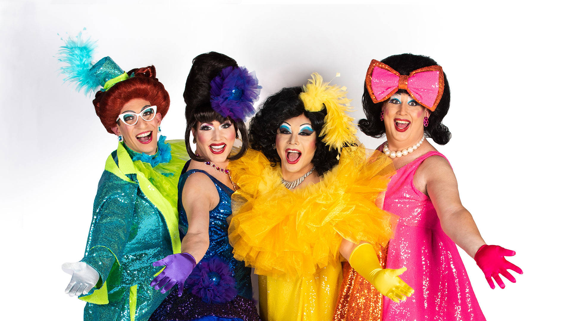 The Kinsey Sicks - four drag performers posing together in bright, colorful sequined formal outfits with ruffles, feathers and bows.