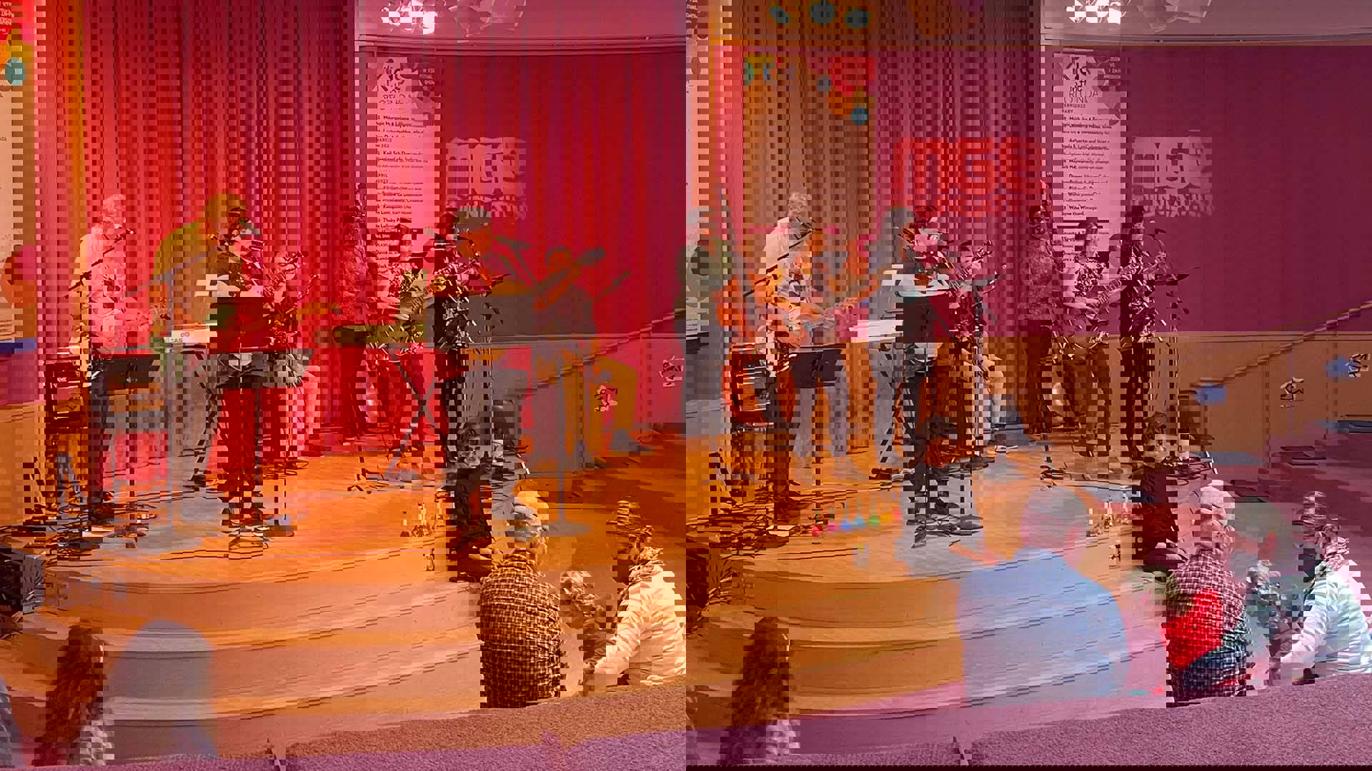 A group of musicians on Rotunda Stage performing lullabies for families