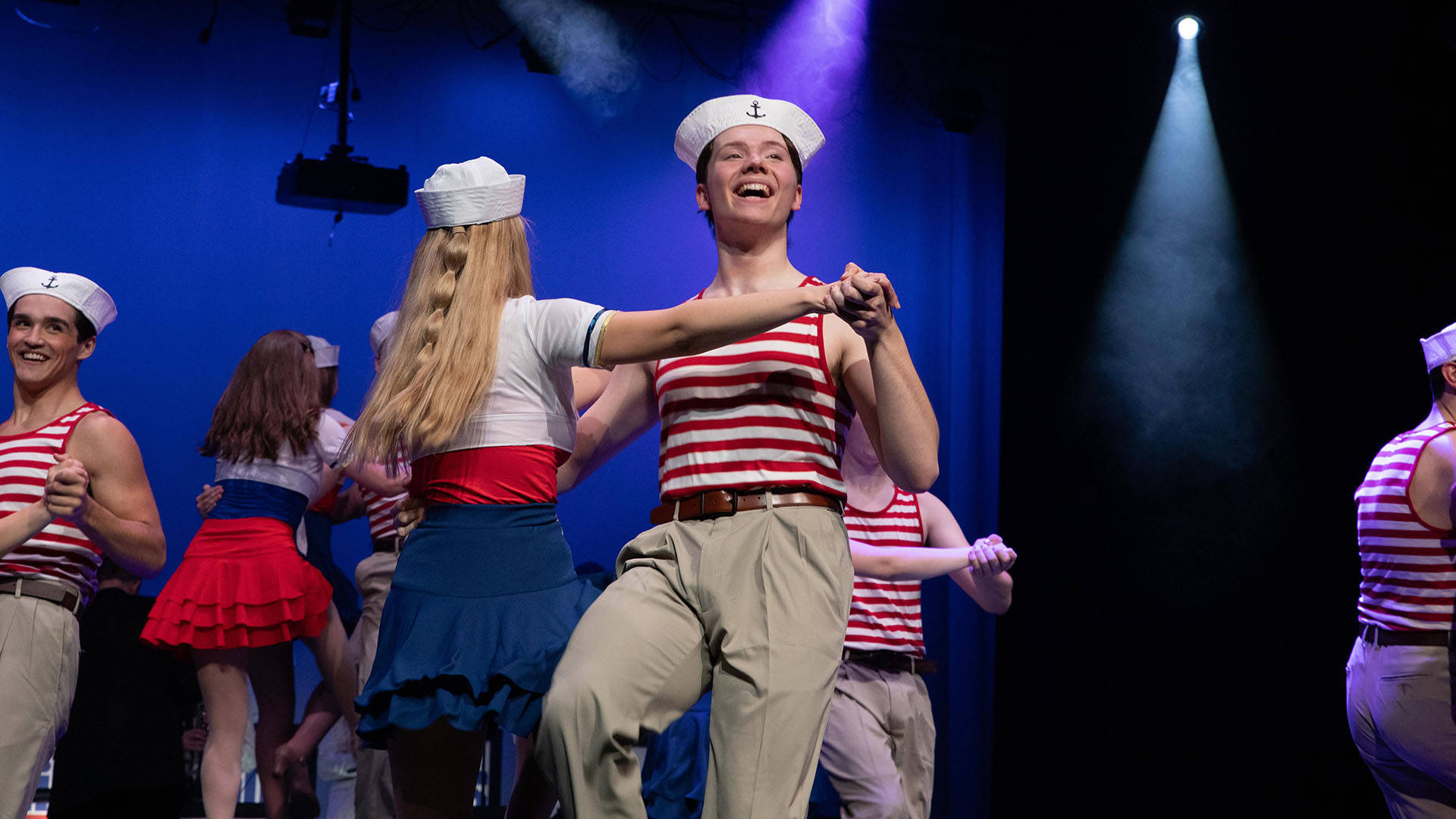 Kids from Wisconsin performing on stage. They are in fun sailor outfits.