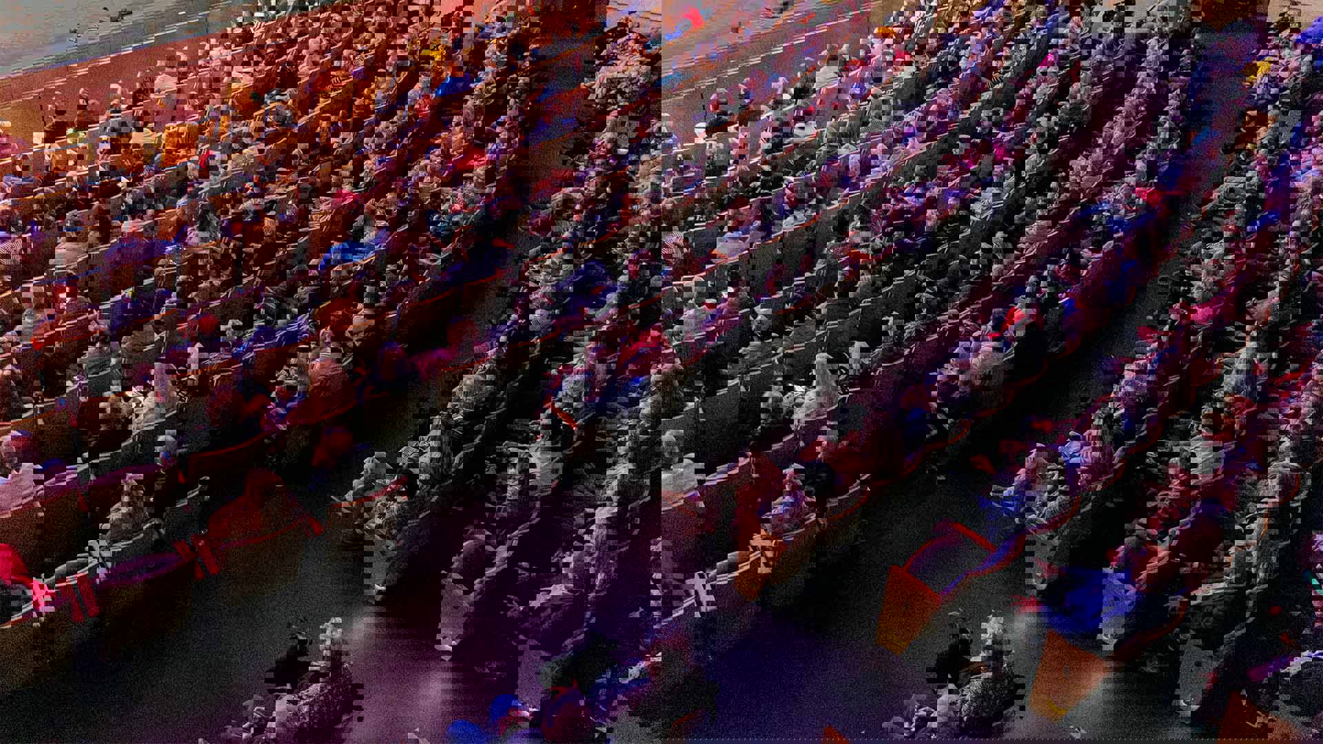 An audience in the orchestra section of Overture Hall seated. View from above.