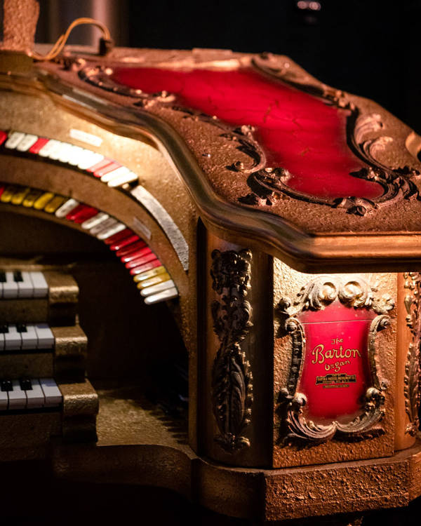close up view of a red and gold organ console. This is the Grand Barton Organ's console.
