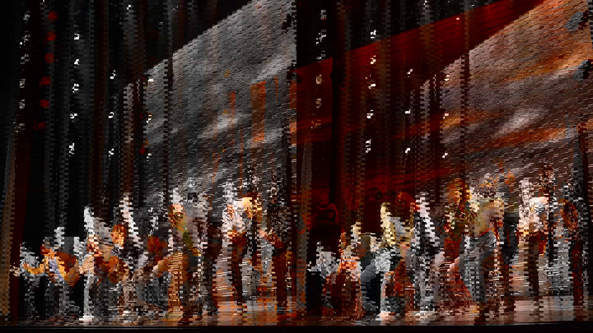 The cast of Come from Away performing on stage