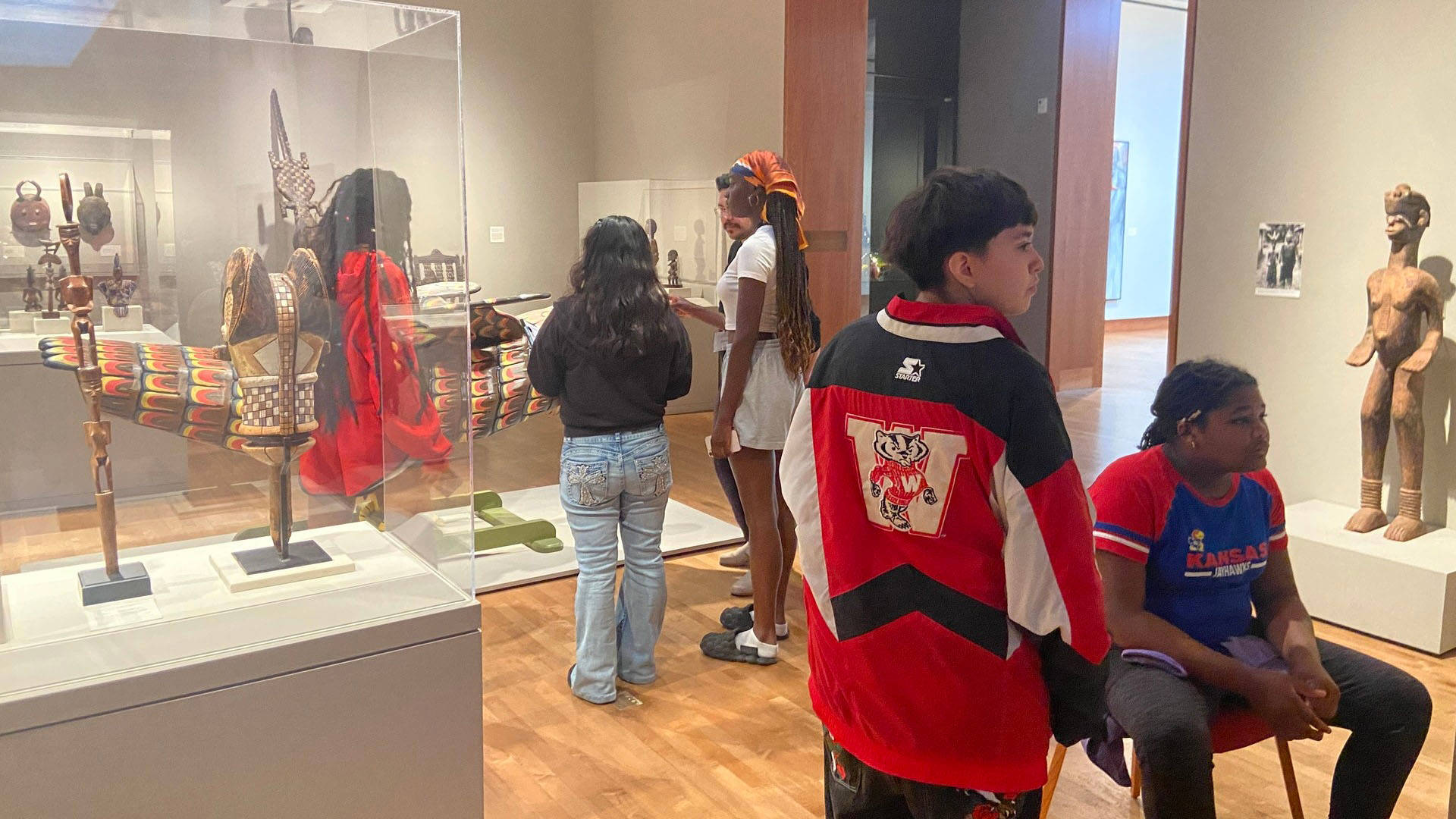 Students walking through an art museum.