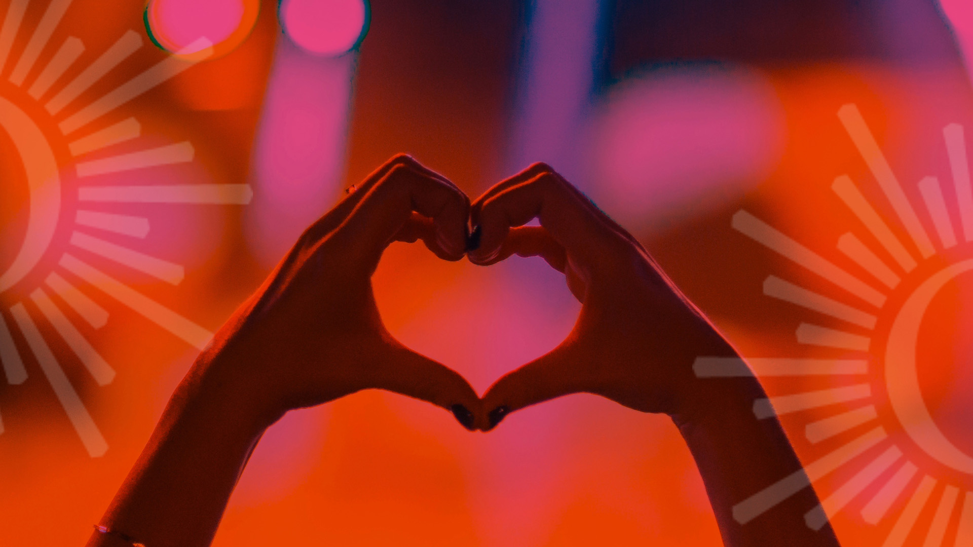 Two hands come together to make a heart shape against a blurry red and pink background. Opaque Overture Center logos are on each side of the banner