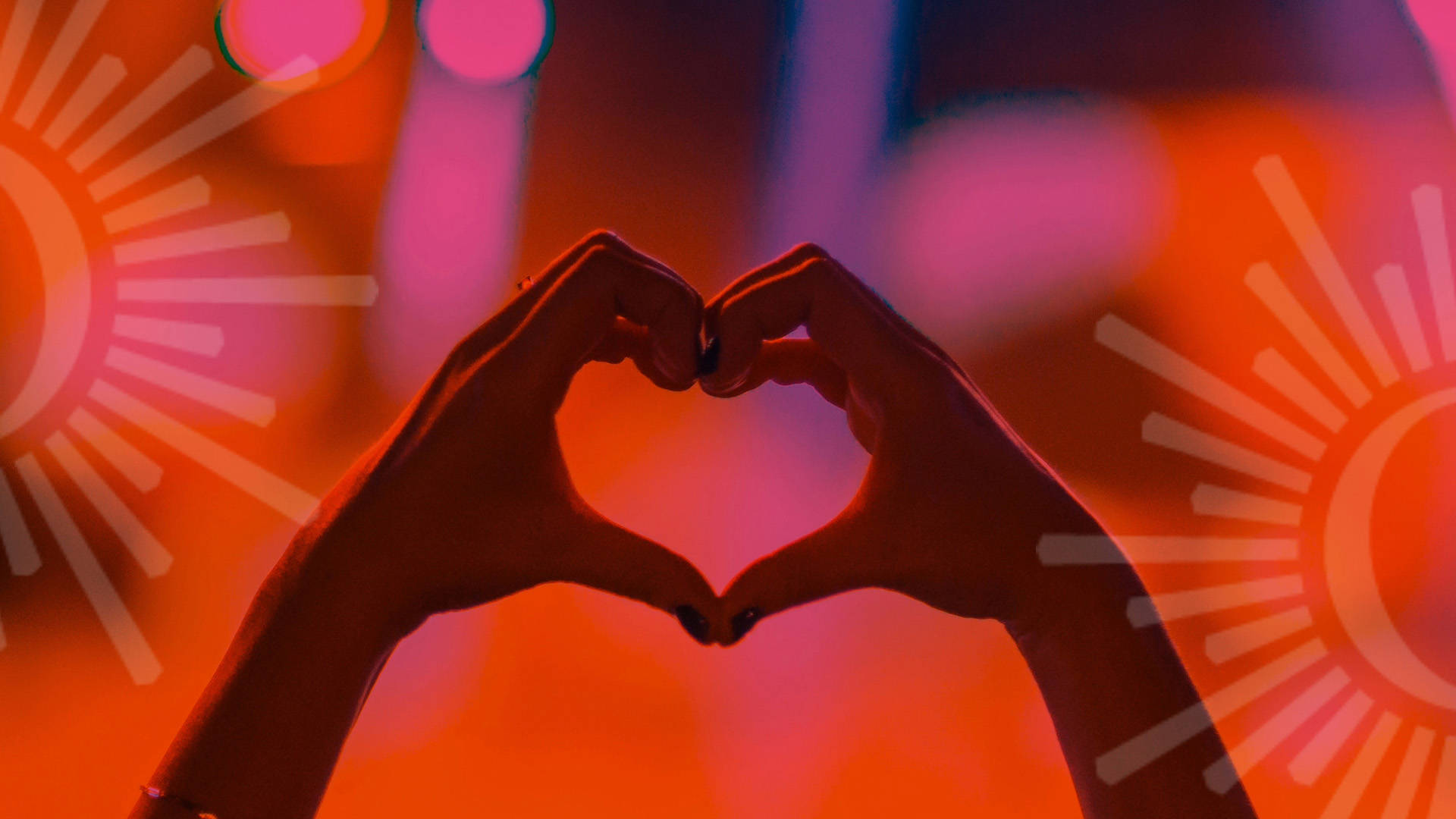 Two hands come together to make a heart shape against a blurry red and pink background. Opaque Overture Center logos are on each side of the banner