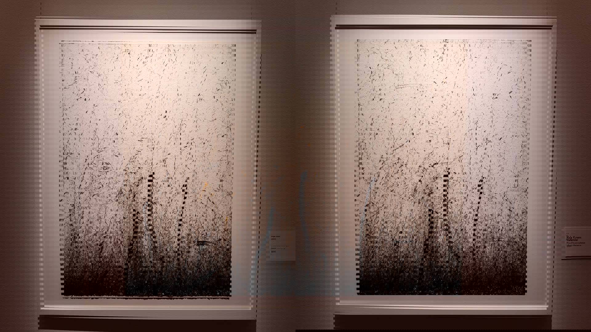 A canvas with chaotic charcoal patterns on it.