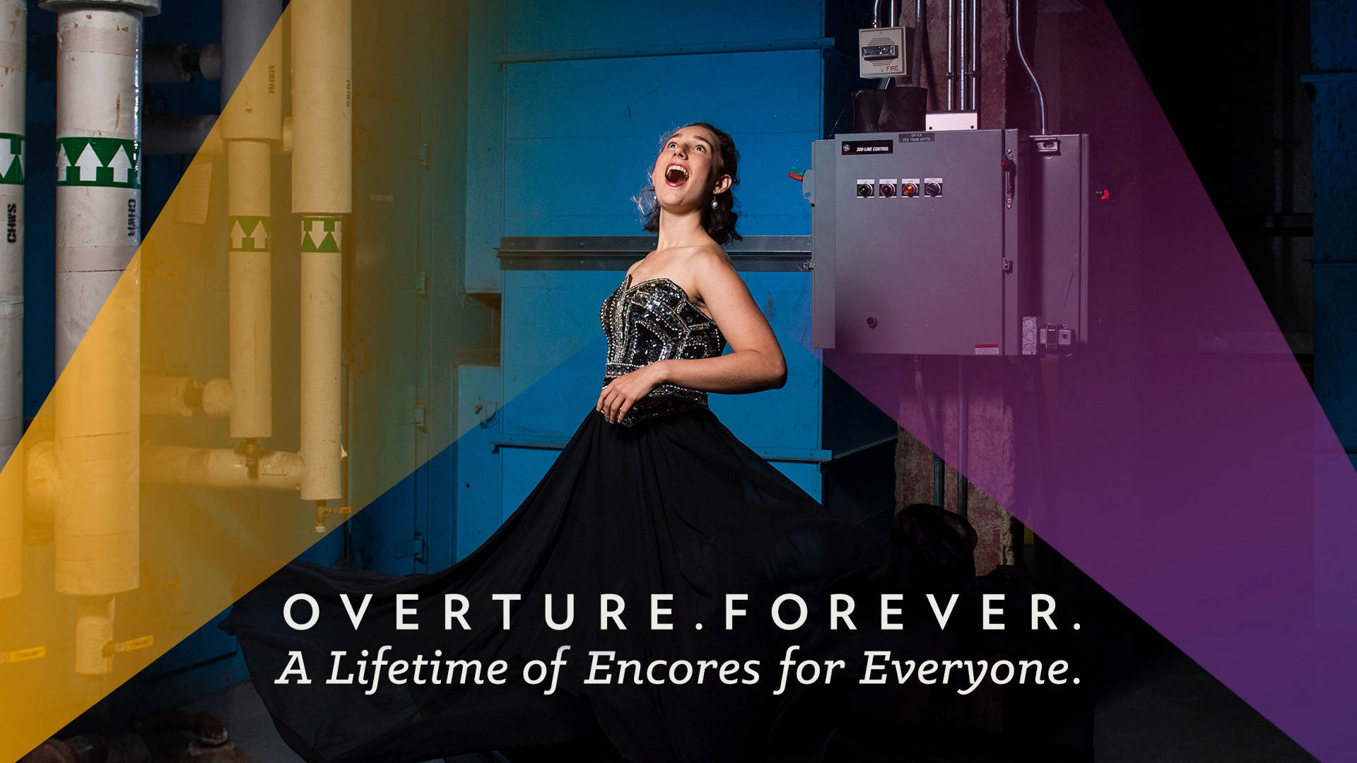 Banner text reads, "Overture. Forever. A Lifetime of Encores for Everyone." A woman with light complexion and shoulder-length brown hair wears a sleeveless black opera dress while singing upwards. She is in an industrial setting with large pipes behind her. There are opaque yellow and purple streaks in the design.