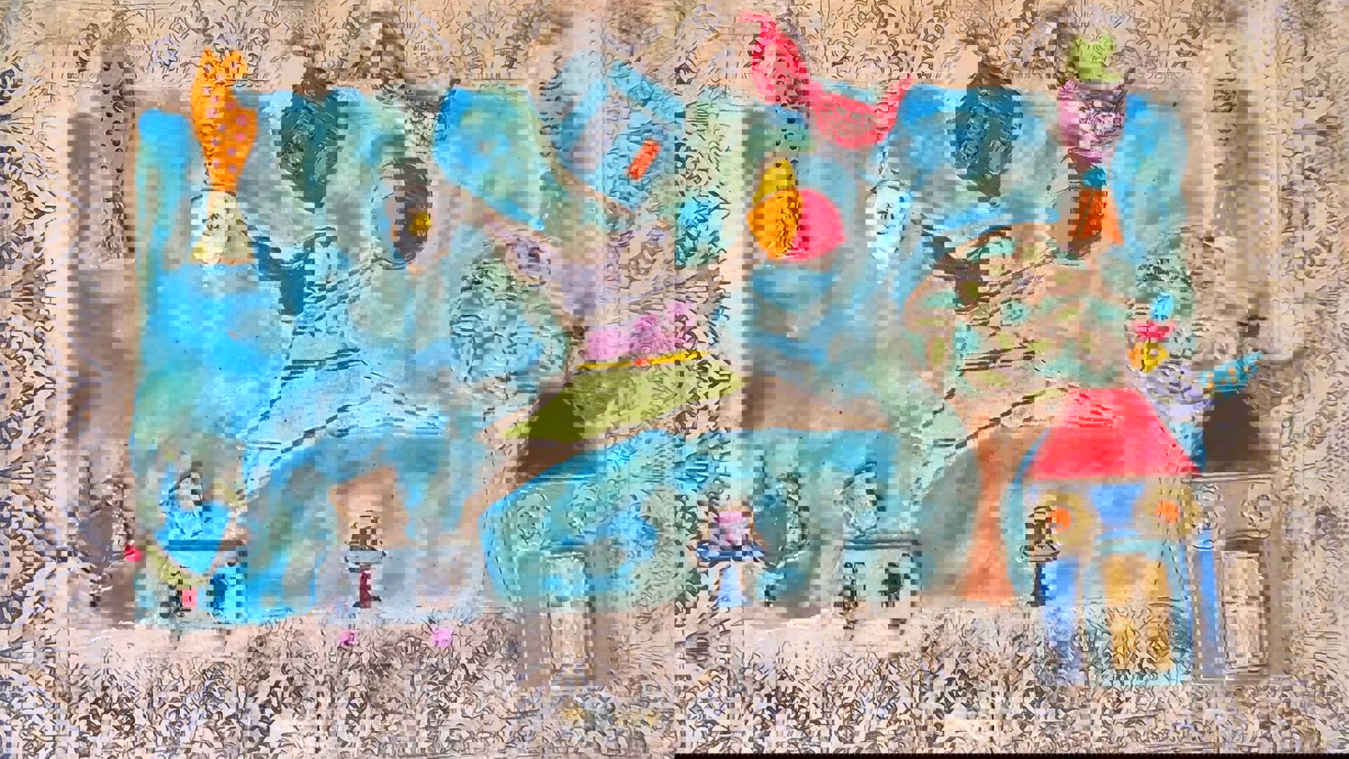 A ceramic tableau with an ornate border. A leaping woman holding a beach ball against a blue background with a house, tree, birds, and various household items depicted.