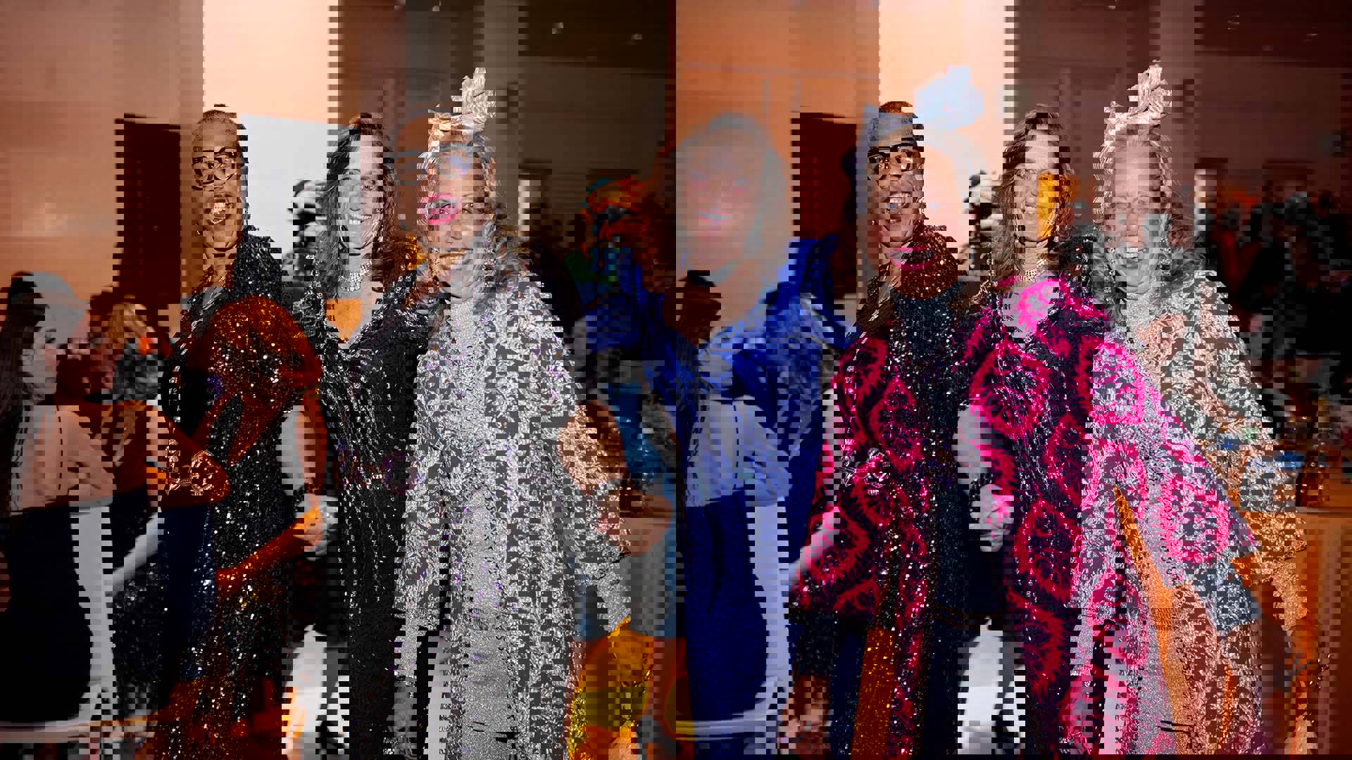 Three smiling people pose together for a photo.