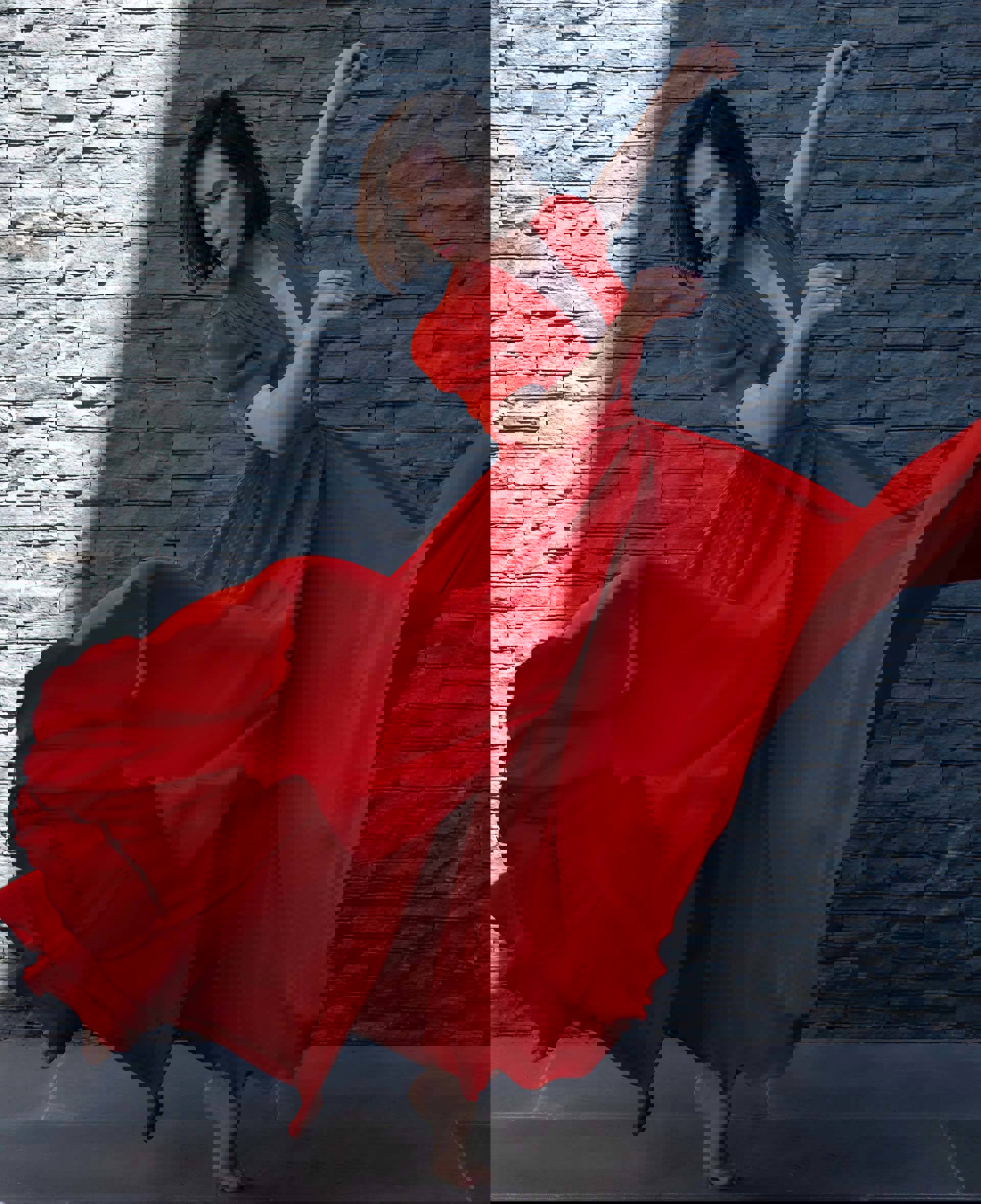 A dancer in a flowing red dress