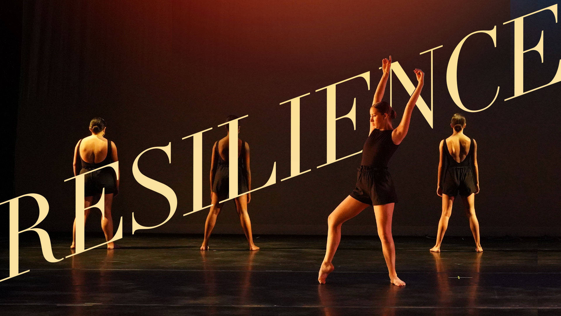 Banner text reads: "Resilience" Four dancers in various poses on a stage. They are all wearing black outfits.
