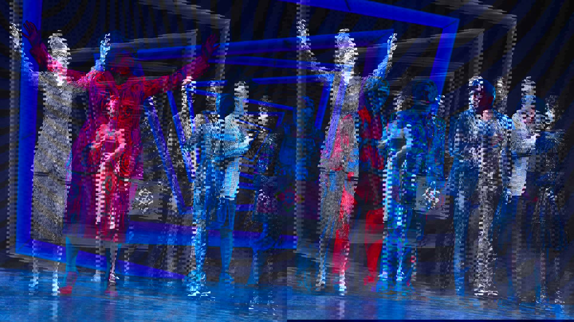 The cast of Beetlejuice performing on stage.